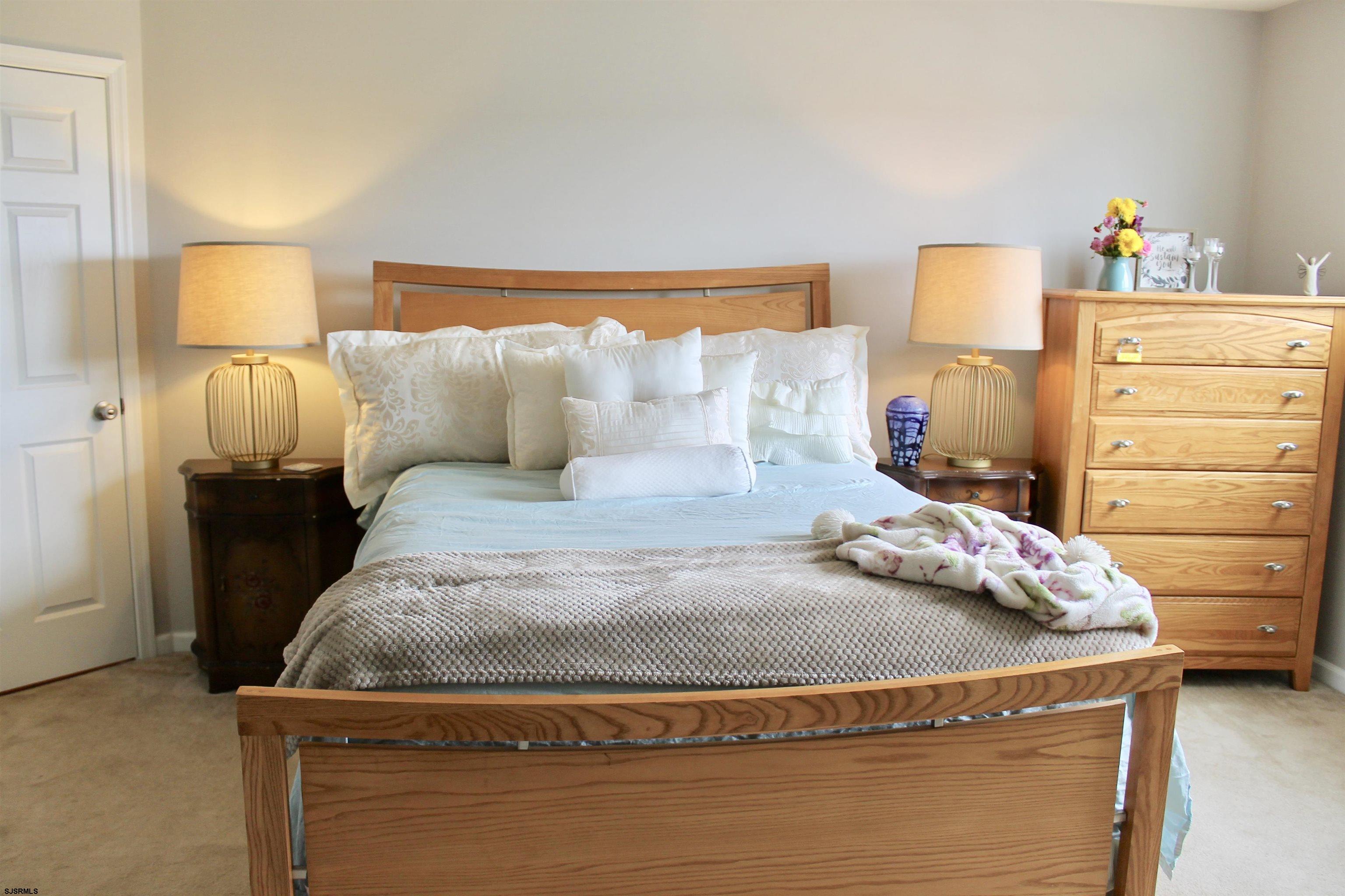 130 Dunlin Lane, Unit 16 Pleasantville, NJ 08232 - Photo 15 of 47 a bedroom with a bed and dresser