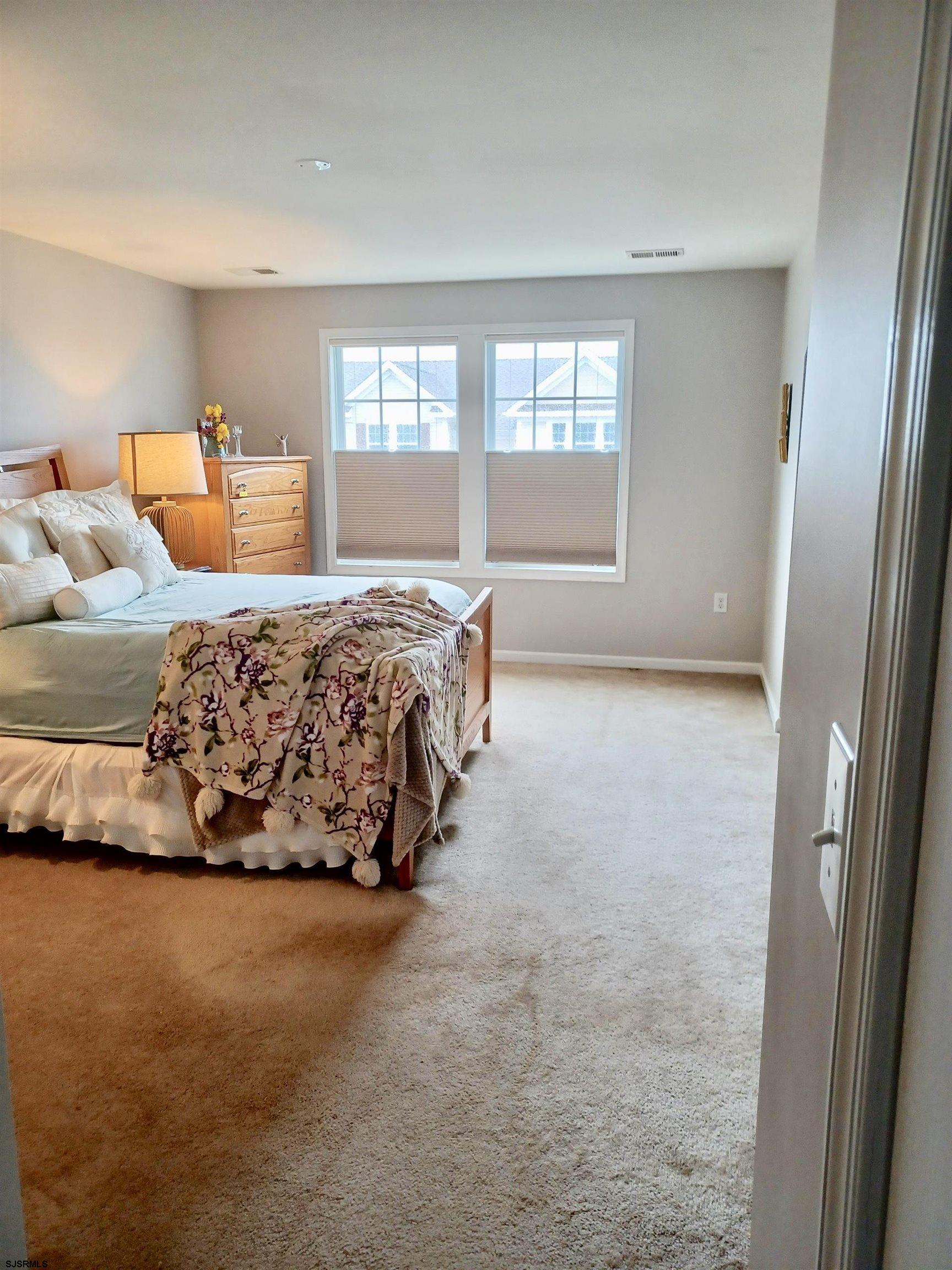 130 Dunlin Lane, Unit 16 Pleasantville, NJ 08232 - Photo 16 of 47 a bedroom with a bed and window