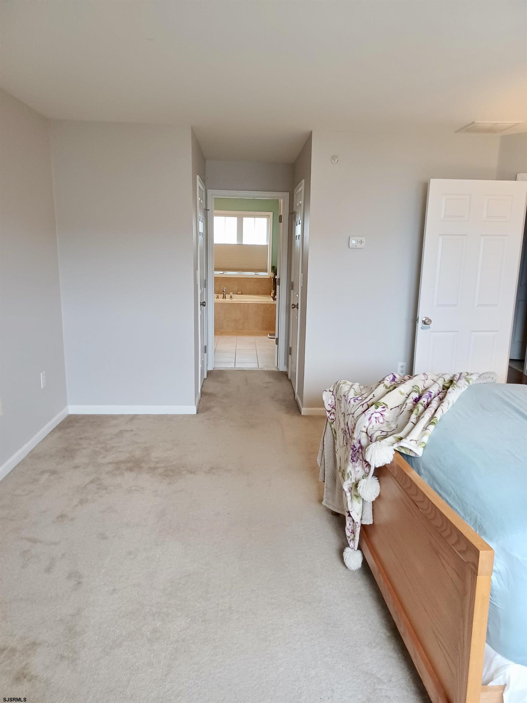 130 Dunlin Lane, Unit 16 Pleasantville, NJ 08232 - Photo 18 of 47 a bed room with a bed and a window