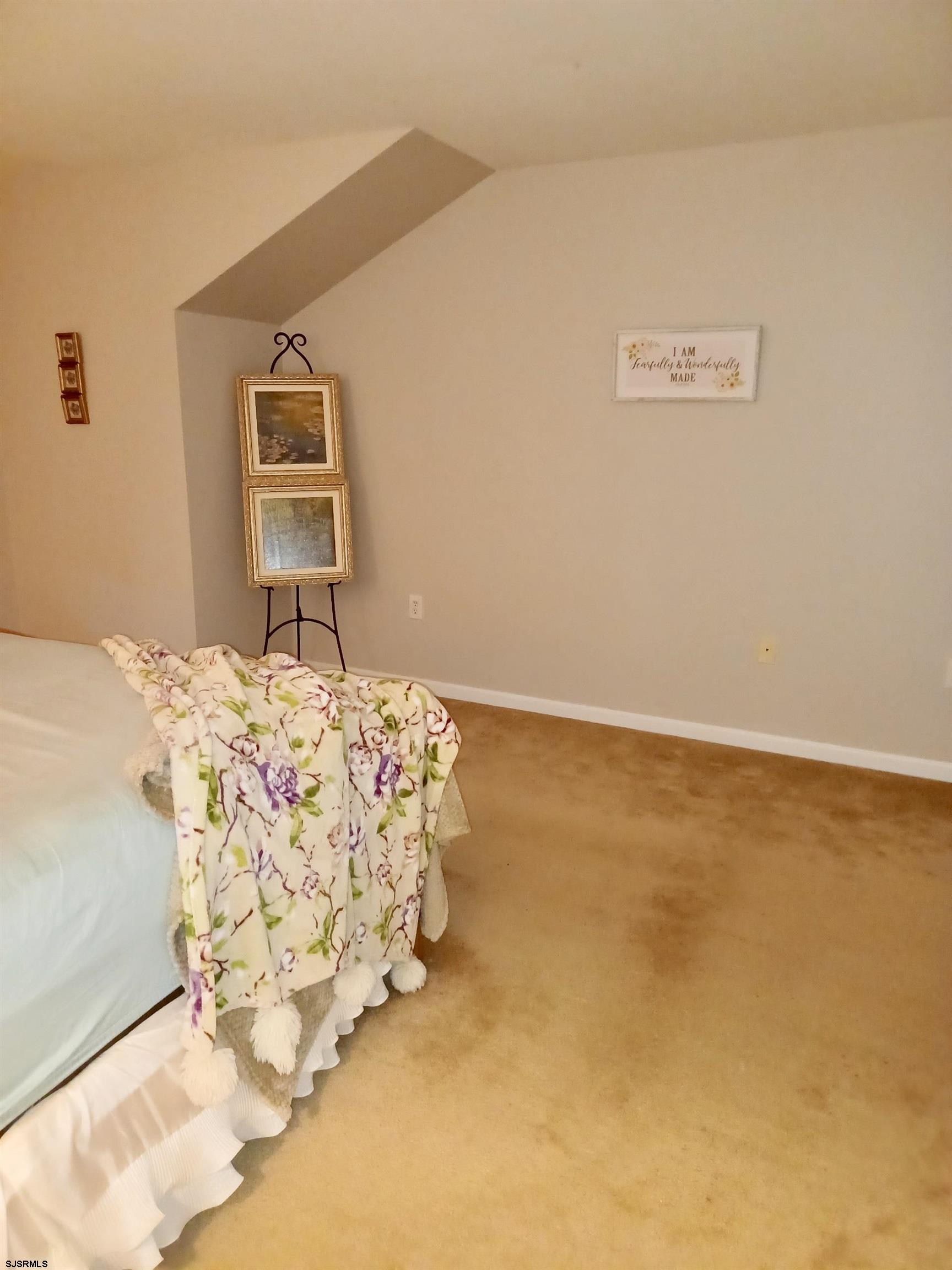 130 Dunlin Lane, Unit 16 Pleasantville, NJ 08232 - Photo 19 of 47 a bed sitting in a bedroom next to a window