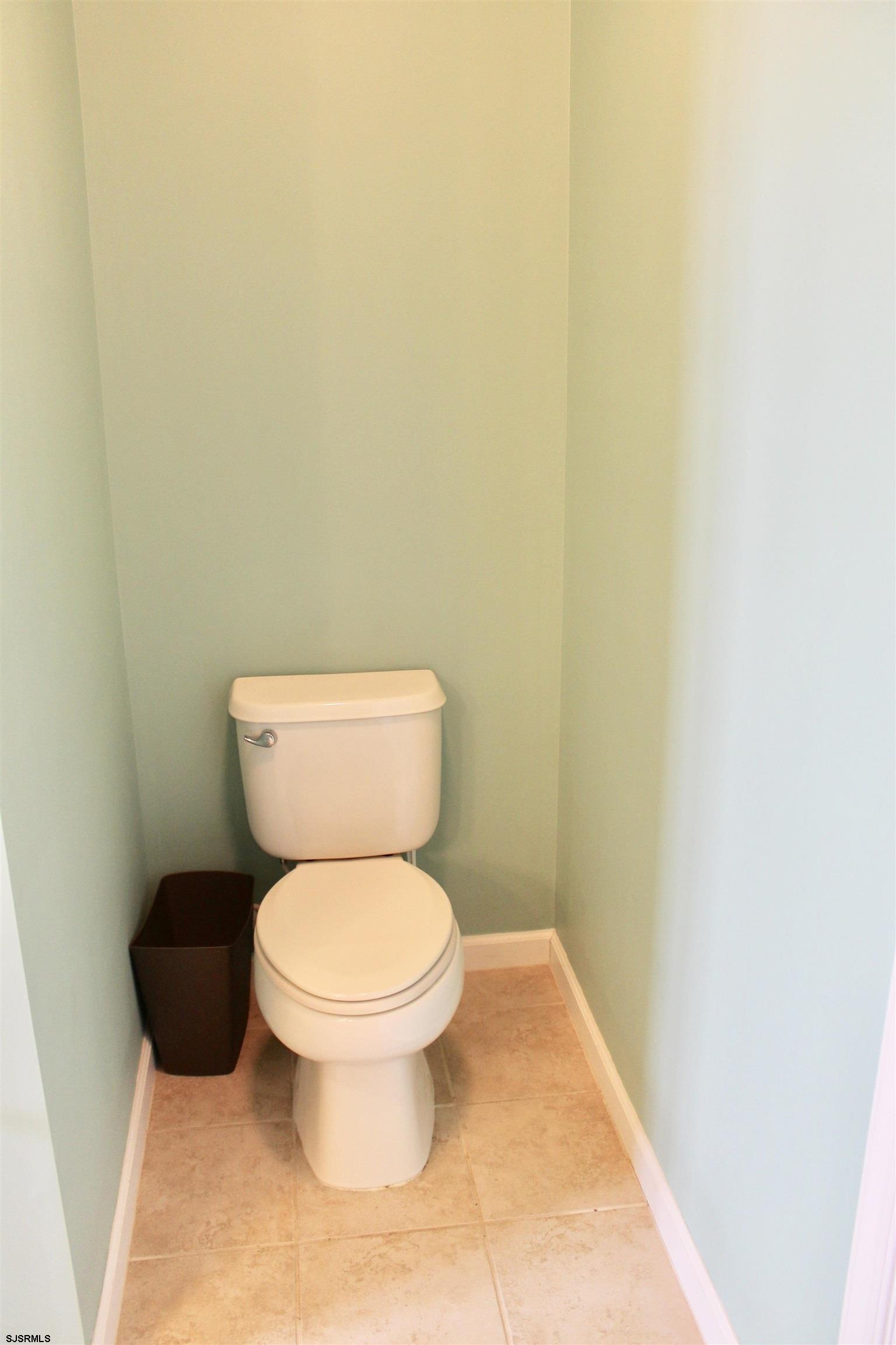 130 Dunlin Lane, Unit 16 Pleasantville, NJ 08232 - Photo 24 of 47 a white toilet sitting next to a white wall