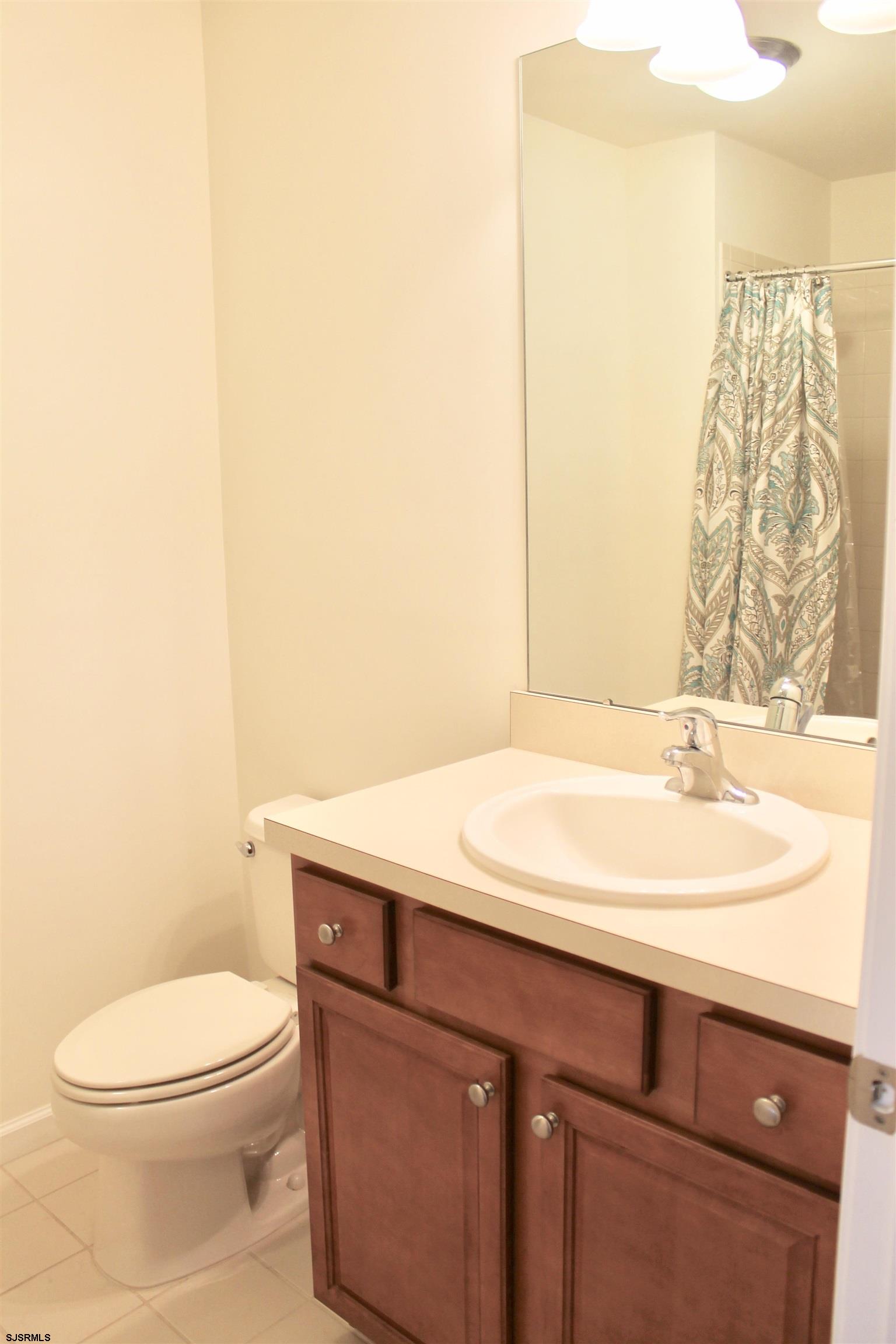 130 Dunlin Lane, Unit 16 Pleasantville, NJ 08232 - Photo 29 of 47 a bathroom with a sink a toilet and shower