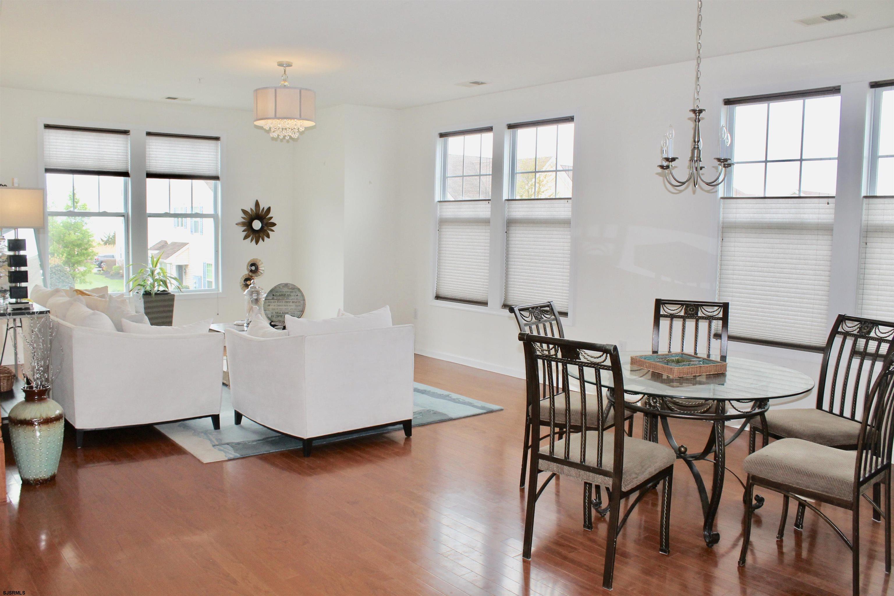 130 Dunlin Lane, Unit 16 Pleasantville, NJ 08232 - Photo 3 of 47 a living room with furniture and wooden floor