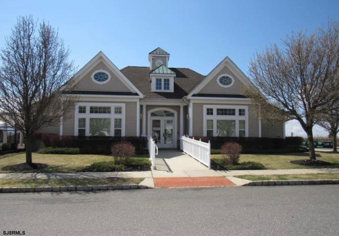 130 Dunlin Lane, Unit 16 Pleasantville, NJ 08232 - Photo 44 of 47 a front view of a house with a yard