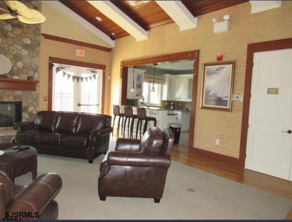 130 Dunlin Lane, Unit 16 Pleasantville, NJ 08232 - Photo 46 of 47 a living room with furniture and a large window