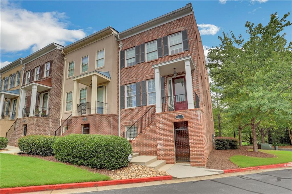 972 Persimmon Point Northeast Sandy Springs, GA 30328 - Photo 1 of 1 a front view of a house with a yard