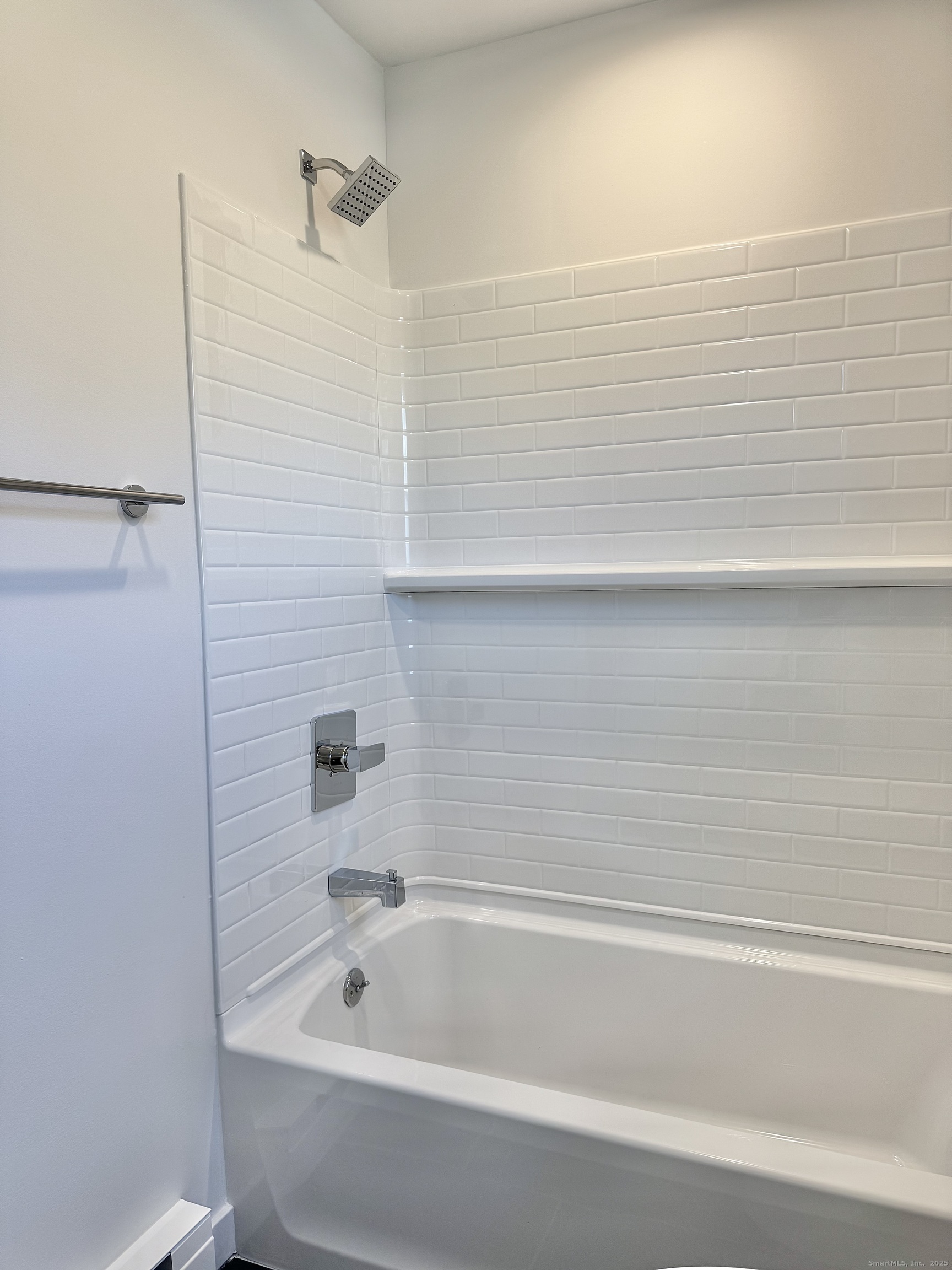 1742 Boston Post Road, Unit 3B Westbrook, CT 06498 - Photo 13 of 16 a bathroom with a bathtub