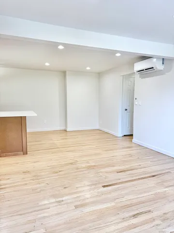 a view of room and wooden floor