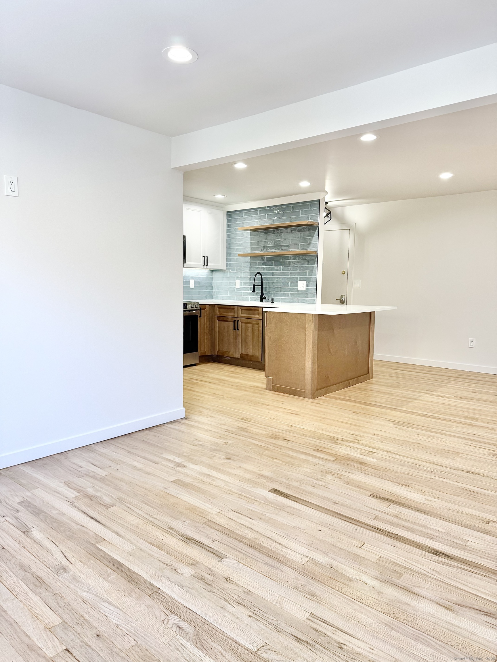 1742 Boston Post Road, Unit 3B Westbrook, CT 06498 - Photo 16 of 16 a view of kitchen and kitchen with wooden floor