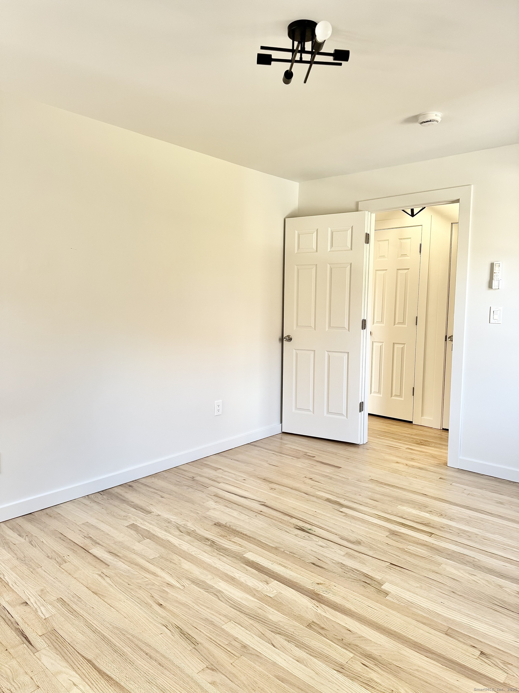 1742 Boston Post Road, Unit 3B Westbrook, CT 06498 - Photo 7 of 16 a view of a room with wooden floor
