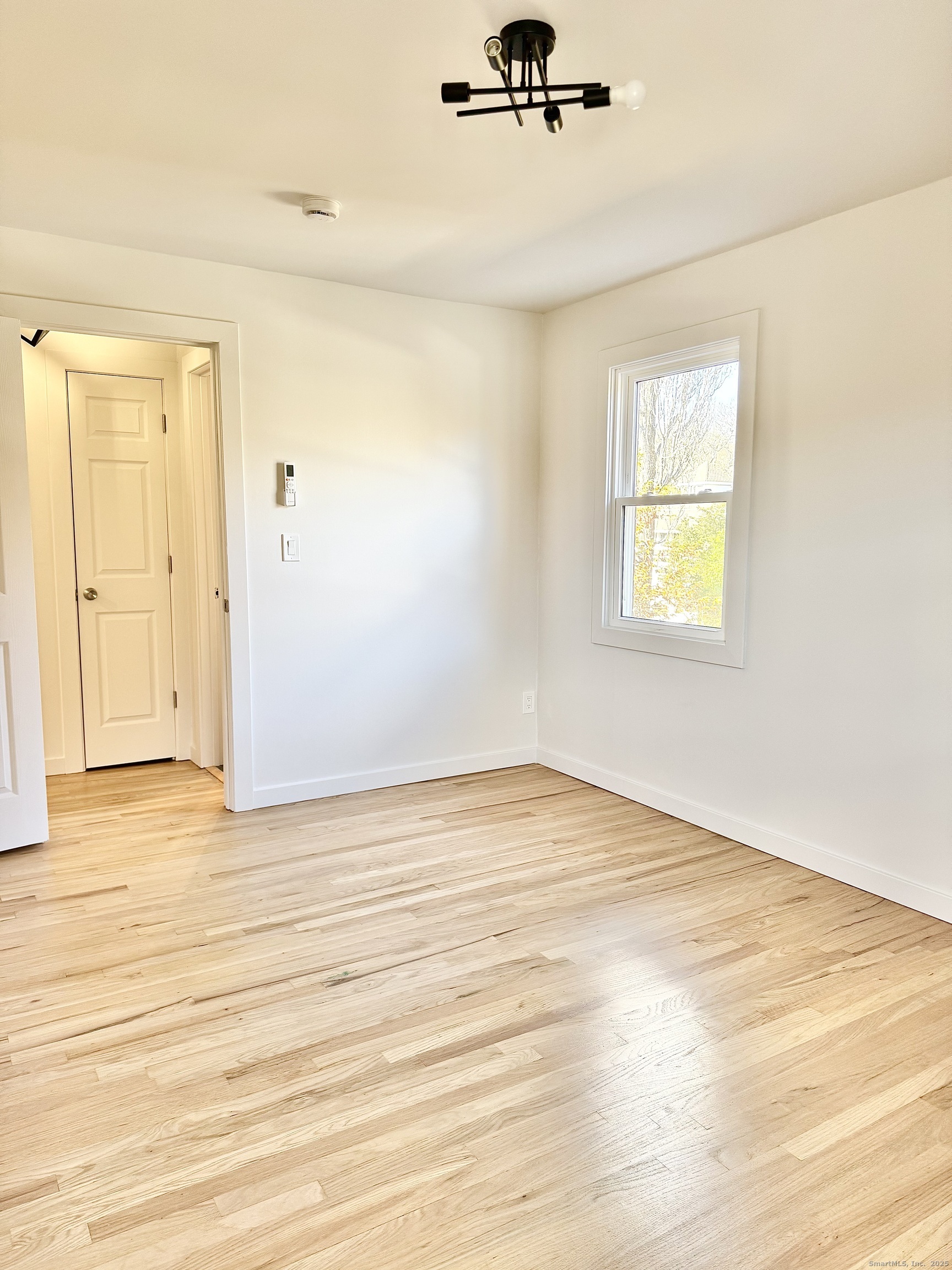 1742 Boston Post Road, Unit 3B Westbrook, CT 06498 - Photo 8 of 16 a view of an empty room with a window