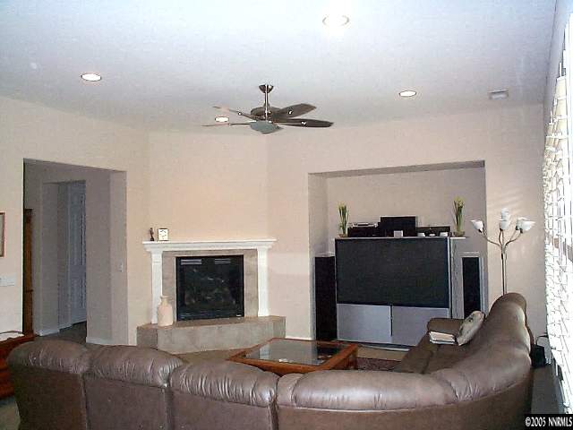 1672 Broadstone Way Reno, NV 89521 - Photo 6 of 8 a living room with furniture and a fireplace
