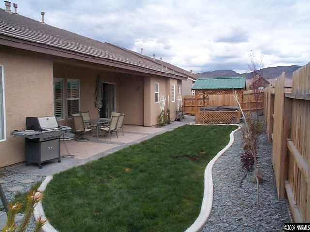 1672 Broadstone Way Reno, NV 89521 - Photo 7 of 8 a front view of a house with garden