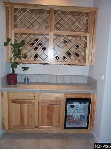 1672 Broadstone Way Reno, NV 89521 - Photo 8 of 8 a kitchen with a cabinets and a fireplace