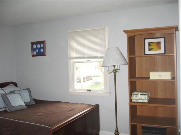 74 Aspen Road Springfield, MA 01128 - Photo 20 of 26 a bedroom with a bed and a window