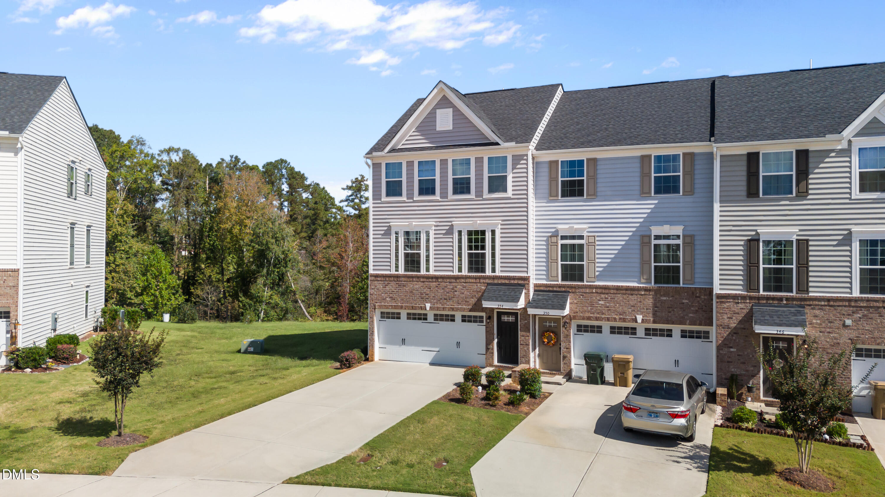 354 Amber Acorn Avenue Raleigh, NC 27603 - Photo 11 of 47 a front view of a house with garden