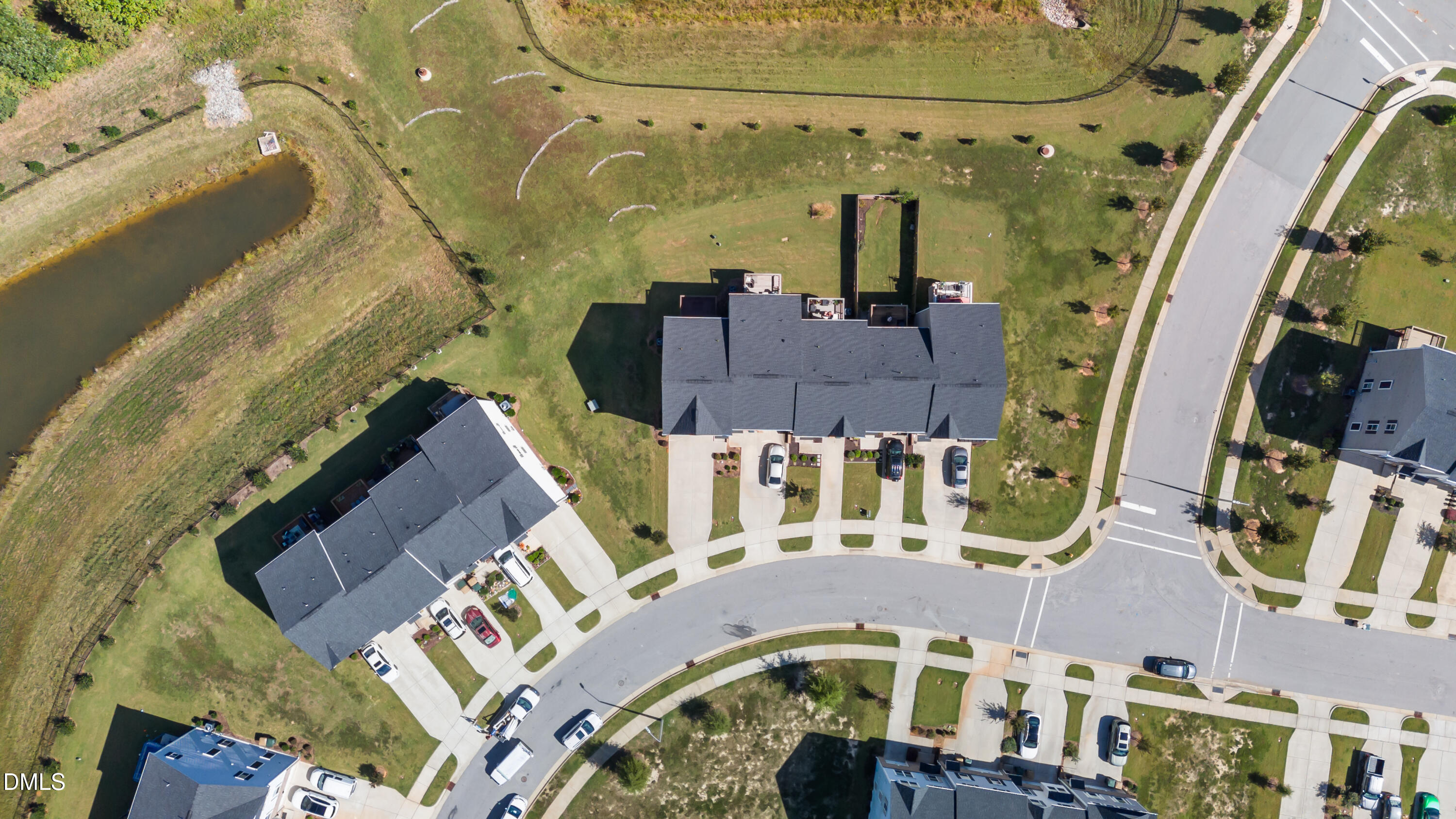 354 Amber Acorn Avenue Raleigh, NC 27603 - Photo 14 of 47 an aerial view of a residential apartment building with a yard
