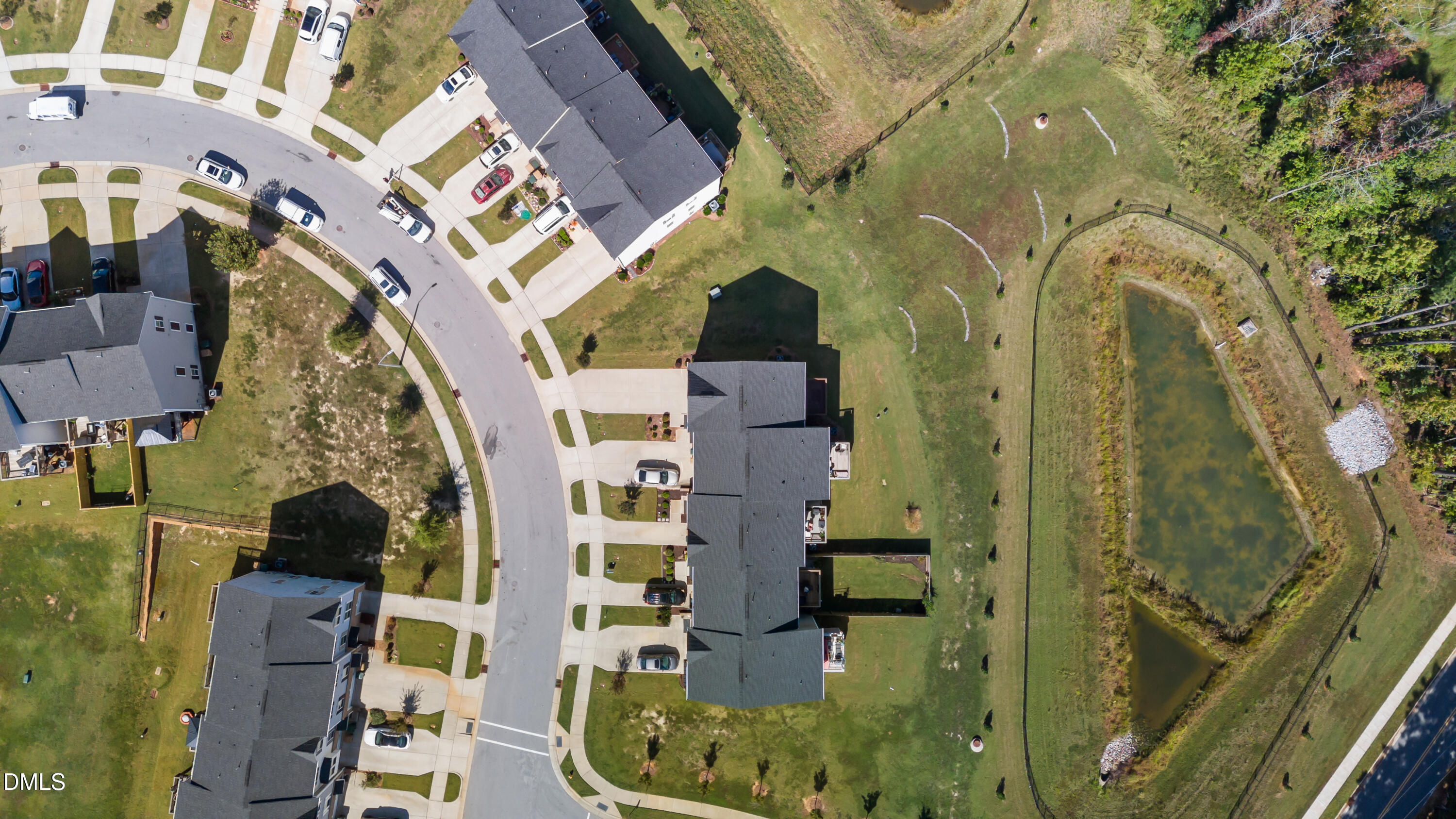 354 Amber Acorn Avenue Raleigh, NC 27603 - Photo 15 of 47 an aerial view of a residential apartment building with a yard