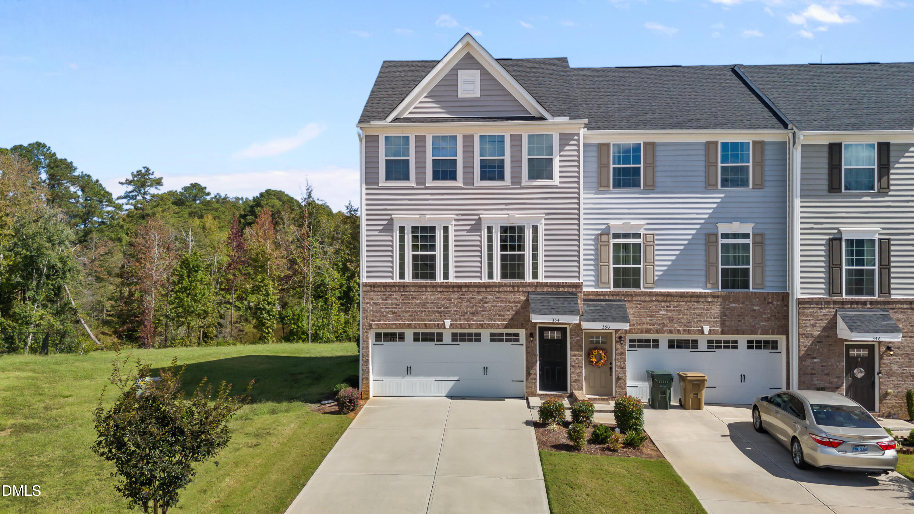 354 Amber Acorn Avenue Raleigh, NC 27603 - Photo 2 of 47 a view of multiple houses with a yard