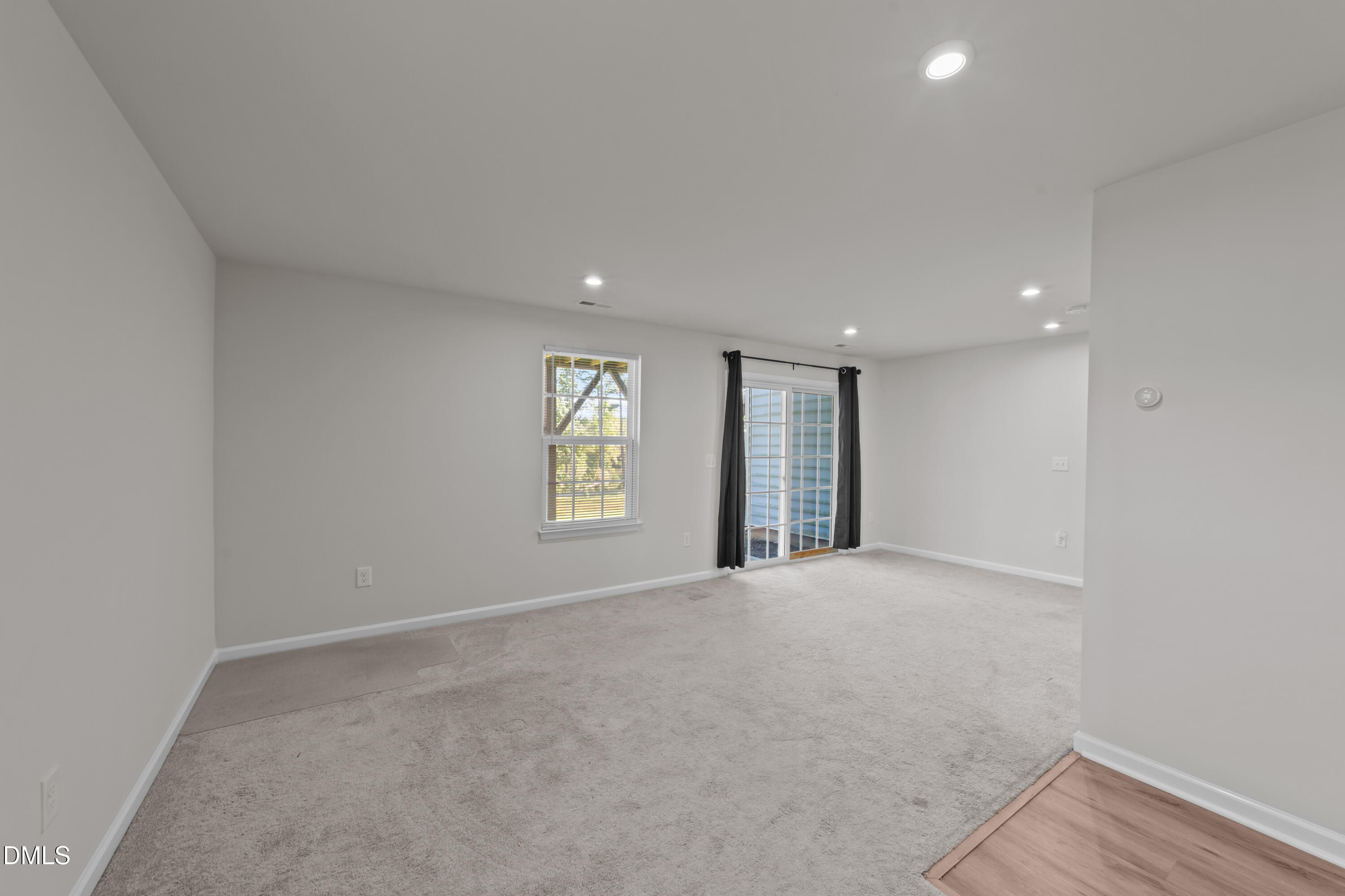 354 Amber Acorn Avenue Raleigh, NC 27603 - Photo 23 of 47 a view of an empty room with a window