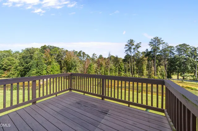 a view of a balcony with wooden floor