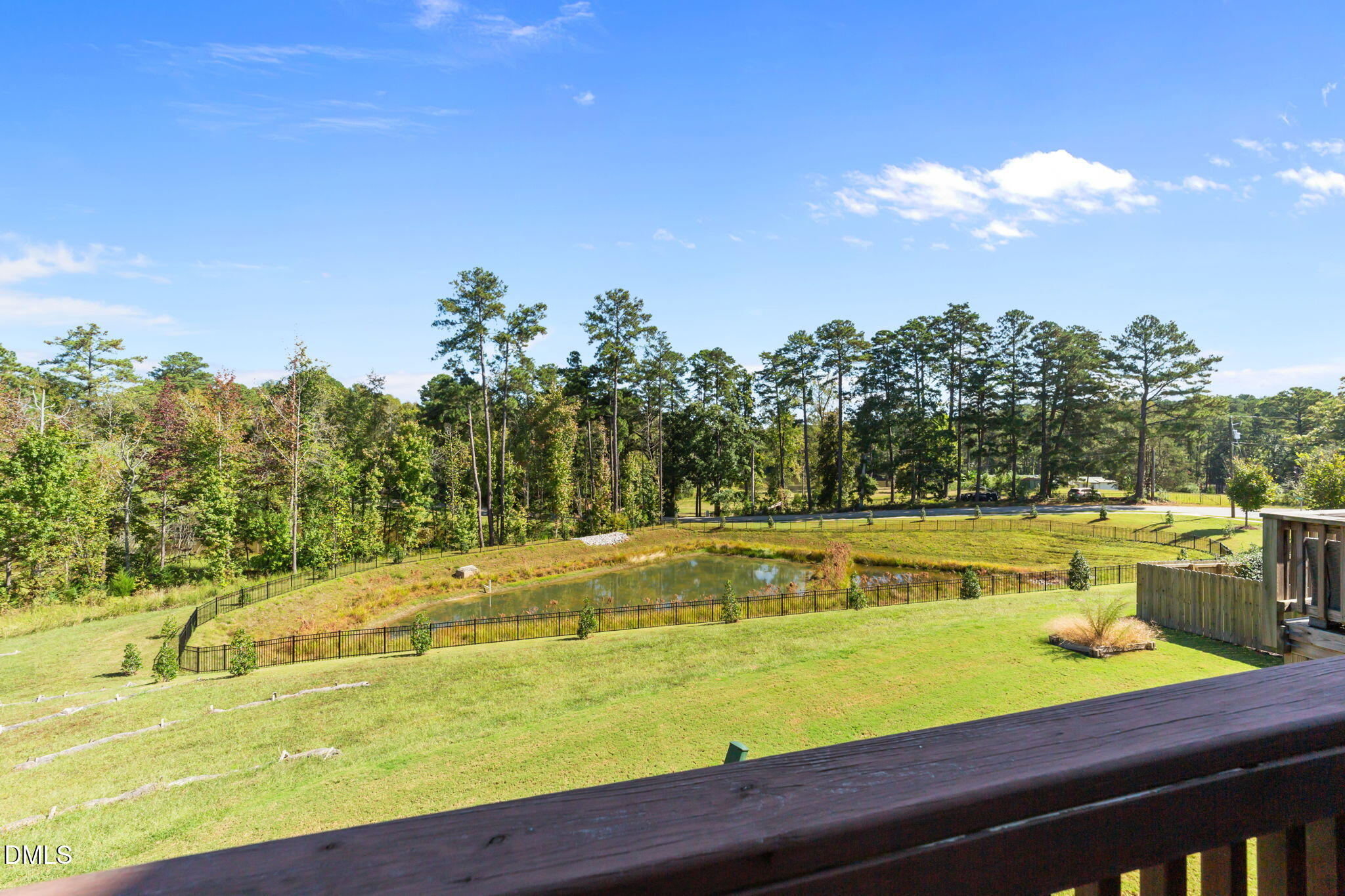 354 Amber Acorn Avenue Raleigh, NC 27603 - Photo 31 of 47 a view of a swimming pool with an outdoor seating and a garden