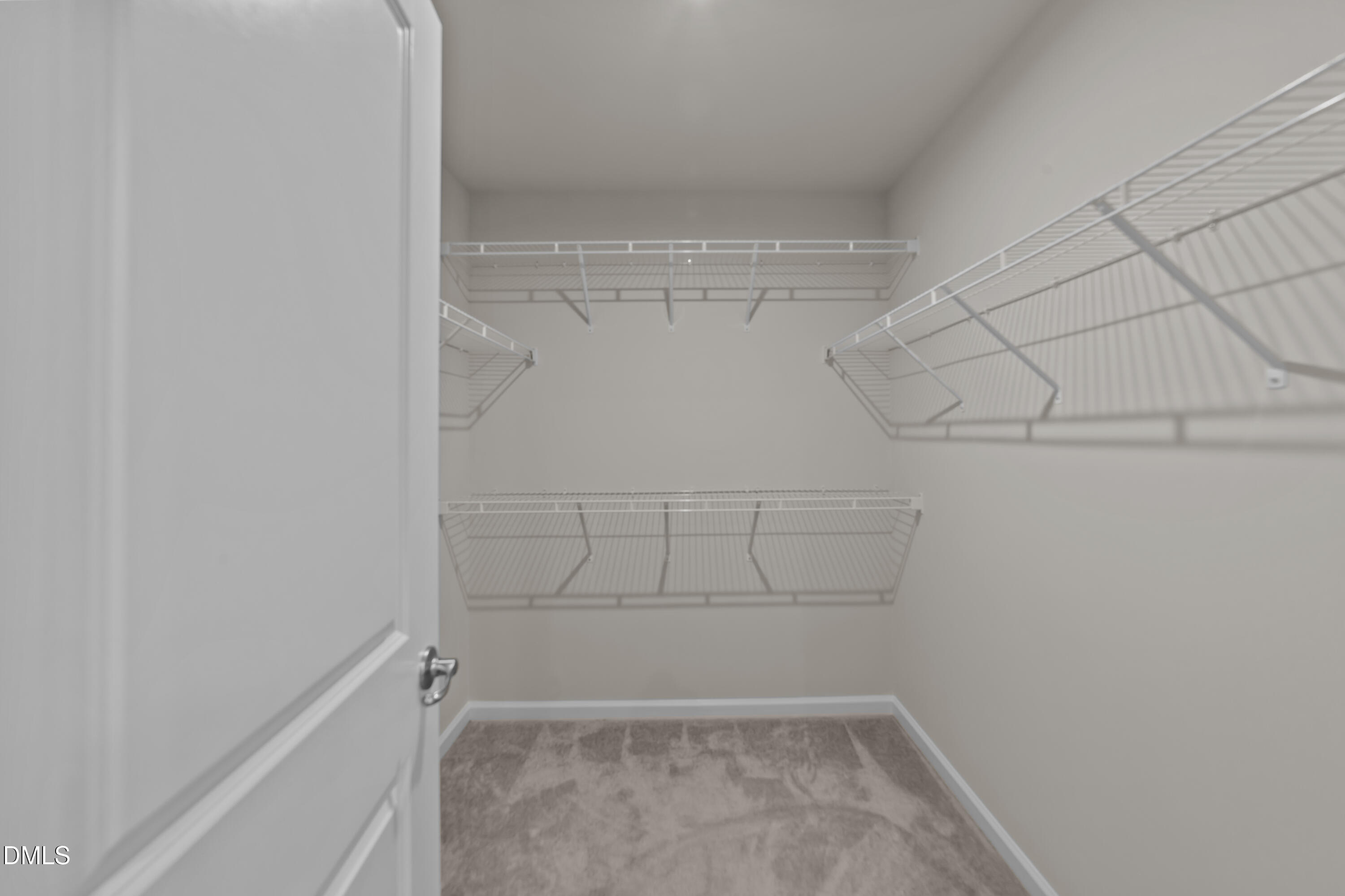 354 Amber Acorn Avenue Raleigh, NC 27603 - Photo 32 of 47 a view of a room with racks on the wall