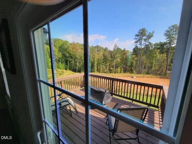 a view of a balcony with wooden floor
