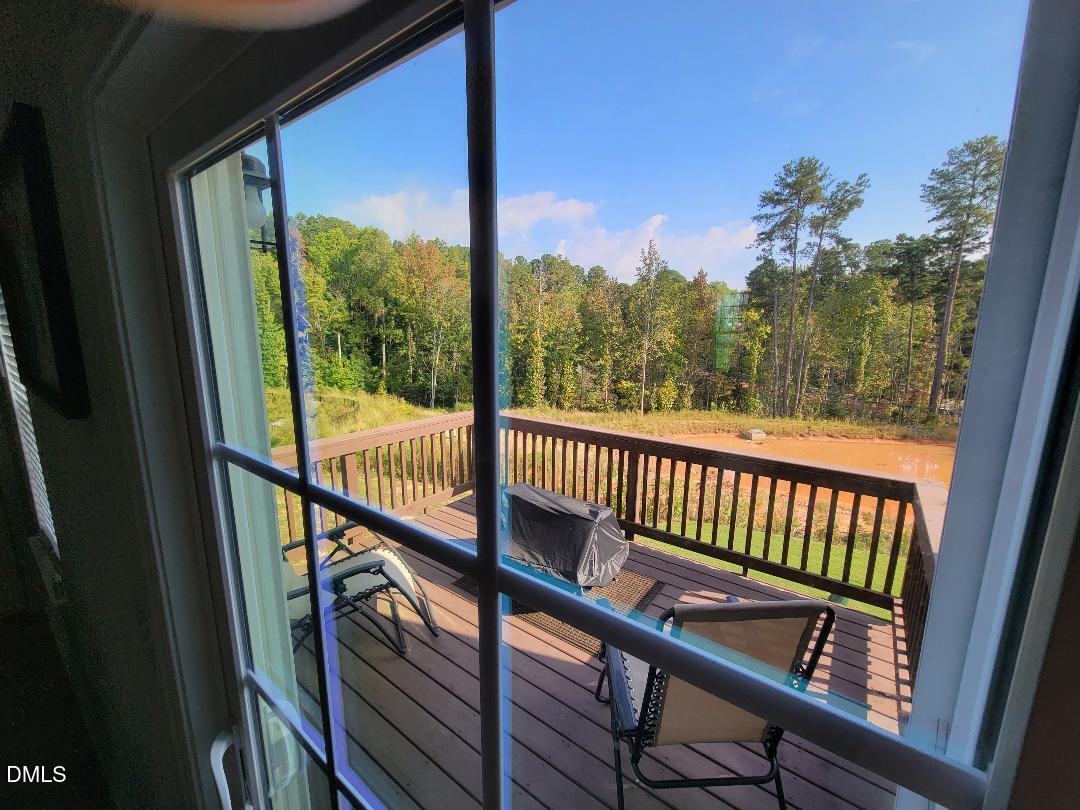354 Amber Acorn Avenue Raleigh, NC 27603 - Photo 46 of 47 a view of a balcony with wooden floor