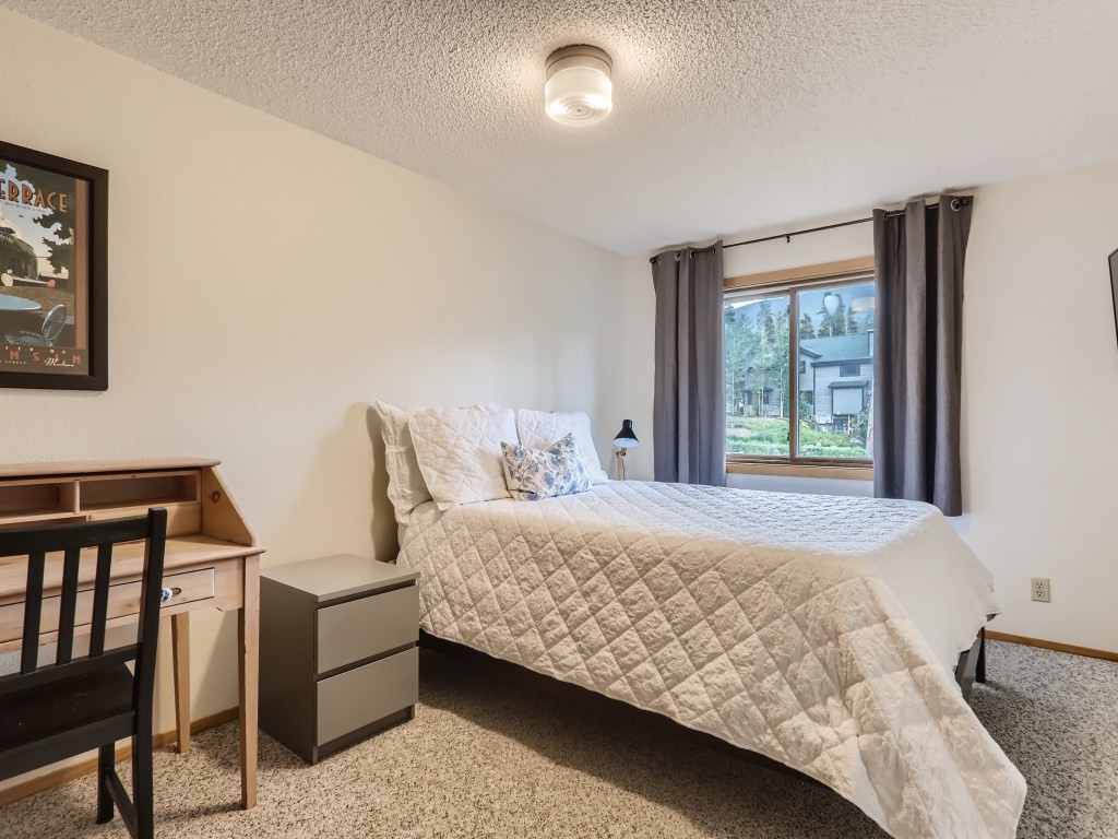 52 Club House Road, Unit 56 Breckenridge, CO 80424 - Photo 13 of 25 a bedroom with a bed and window