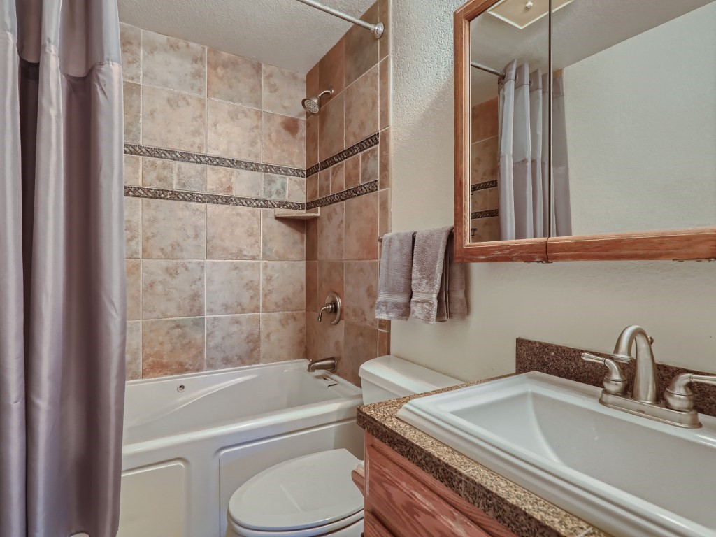 52 Club House Road, Unit 56 Breckenridge, CO 80424 - Photo 15 of 25 a bathroom with a sink toilet and shower