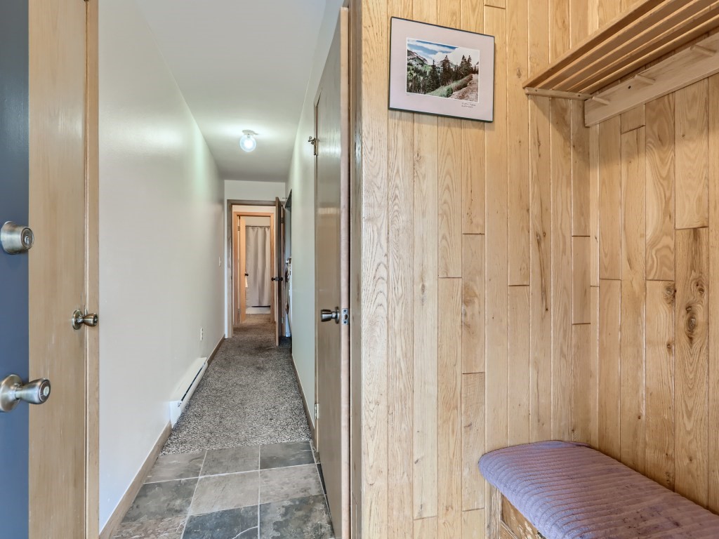 52 Club House Road, Unit 56 Breckenridge, CO 80424 - Photo 19 of 25 a view of a hallway with wooden floor