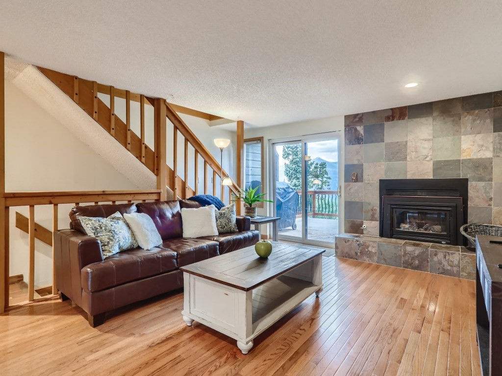 52 Club House Road, Unit 56 Breckenridge, CO 80424 - Photo 2 of 25 a living room with furniture and a fireplace