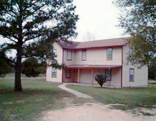 135 Dodd Preston Road Elgin, TX 78621 - Photo 1 of 1 a view of a house with a yard and tree s
