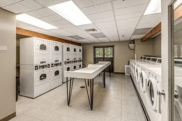 a view of a hallway with furniture