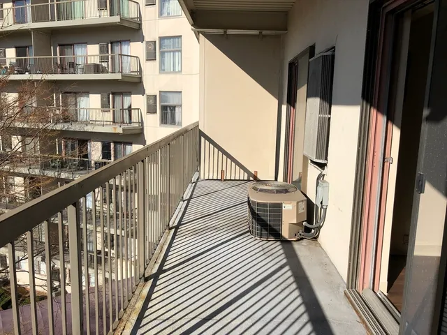 a view of a balcony with furniture