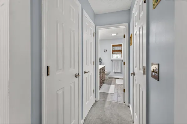 a view of a bathroom from a hallway