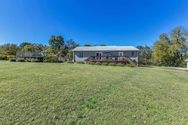 a view of a house with a big yard