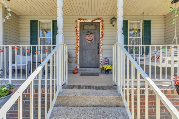 front view of a house with wooden stairs
