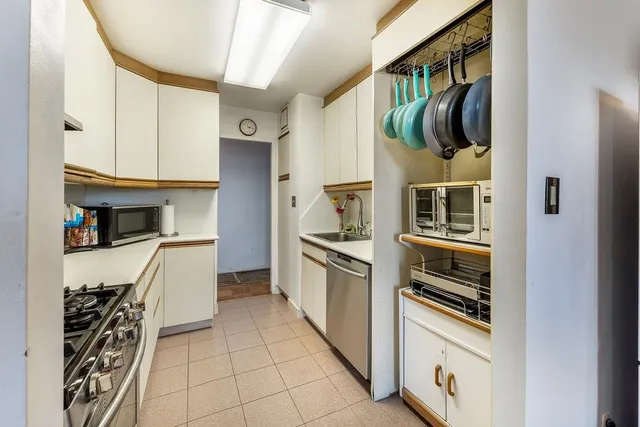 a kitchen with stainless steel appliances a refrigerator and a stove