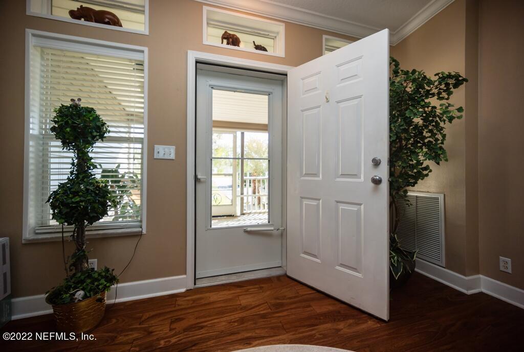 105 South Lake George Drive Georgetown, FL 32139 - Photo 11 of 71 an entryway with wooden floor and potted plants
