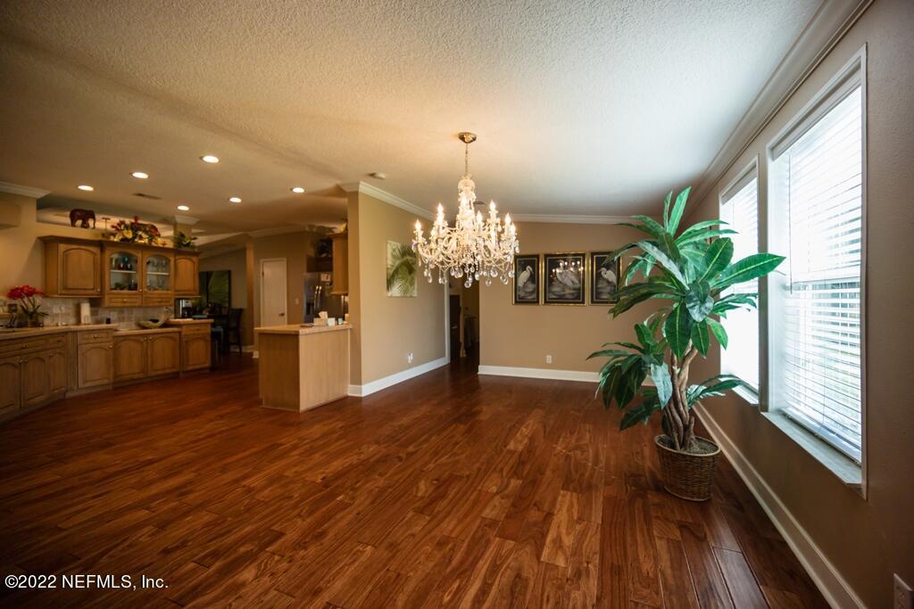 105 South Lake George Drive Georgetown, FL 32139 - Photo 19 of 71 a view of a living room and kitchen with wooden floor