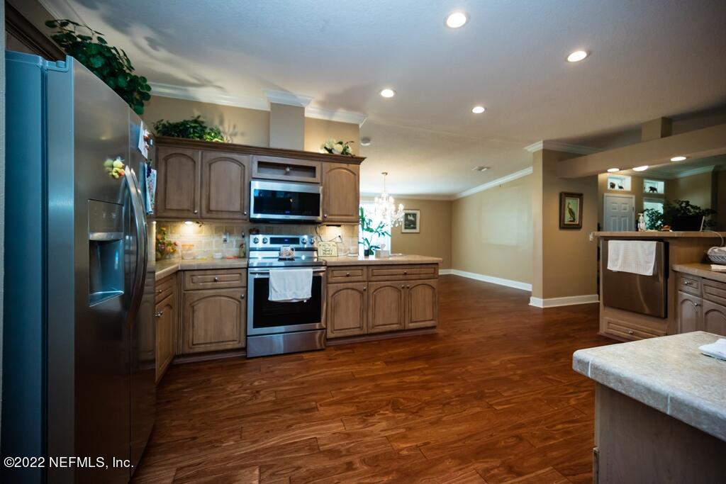 105 South Lake George Drive Georgetown, FL 32139 - Photo 24 of 71 a kitchen with stainless steel appliances granite countertop a refrigerator a stove and a sink