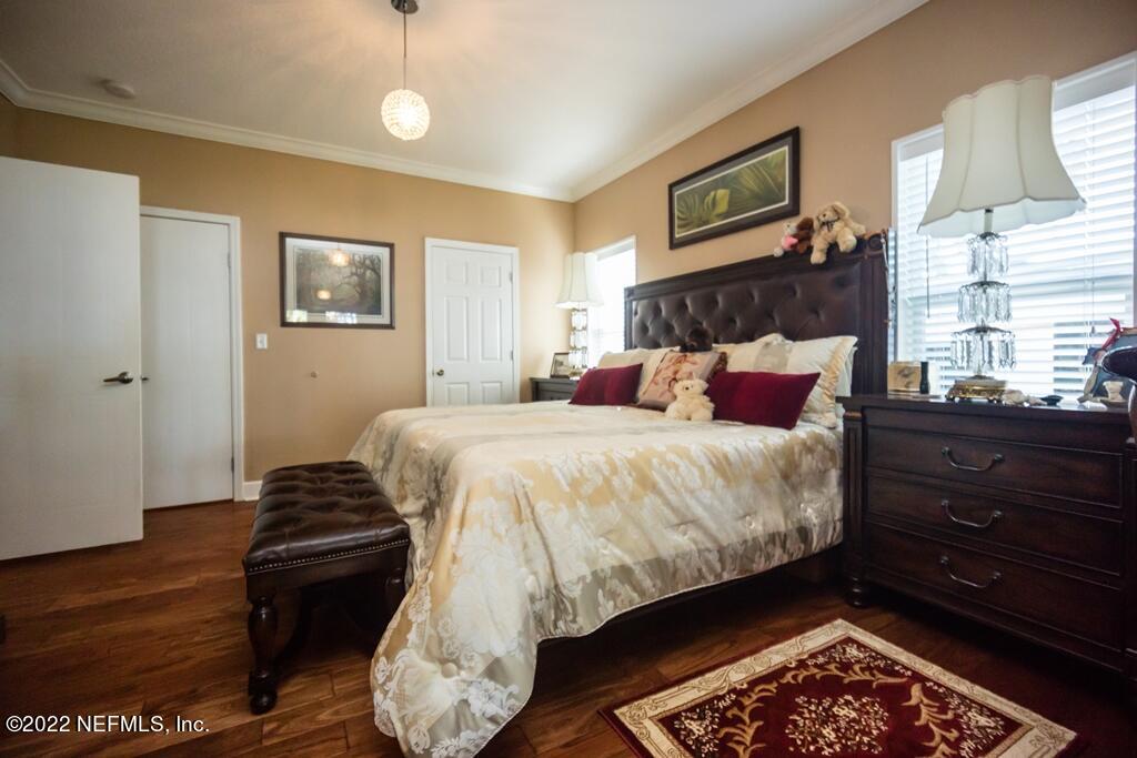 105 South Lake George Drive Georgetown, FL 32139 - Photo 30 of 71 a bedroom with bed and wooden floor