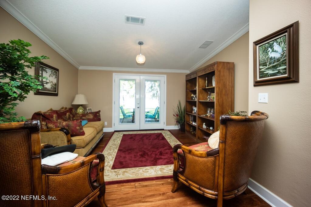 105 South Lake George Drive Georgetown, FL 32139 - Photo 31 of 71 a living room with furniture a window and a flat screen tv