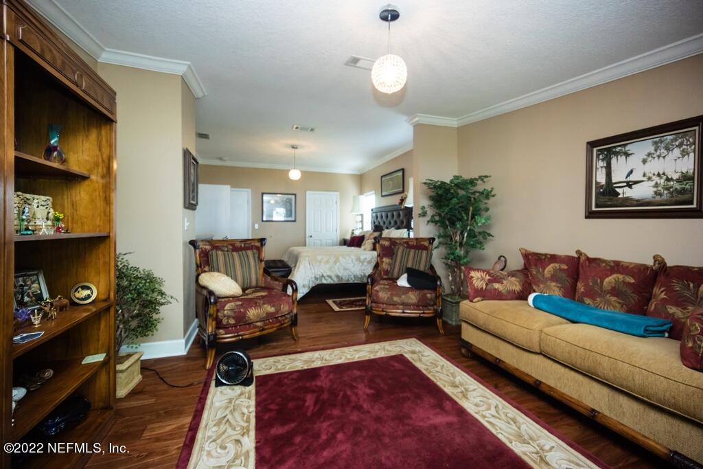 105 South Lake George Drive Georgetown, FL 32139 - Photo 32 of 71 a living room with furniture or couch and a bookshelf