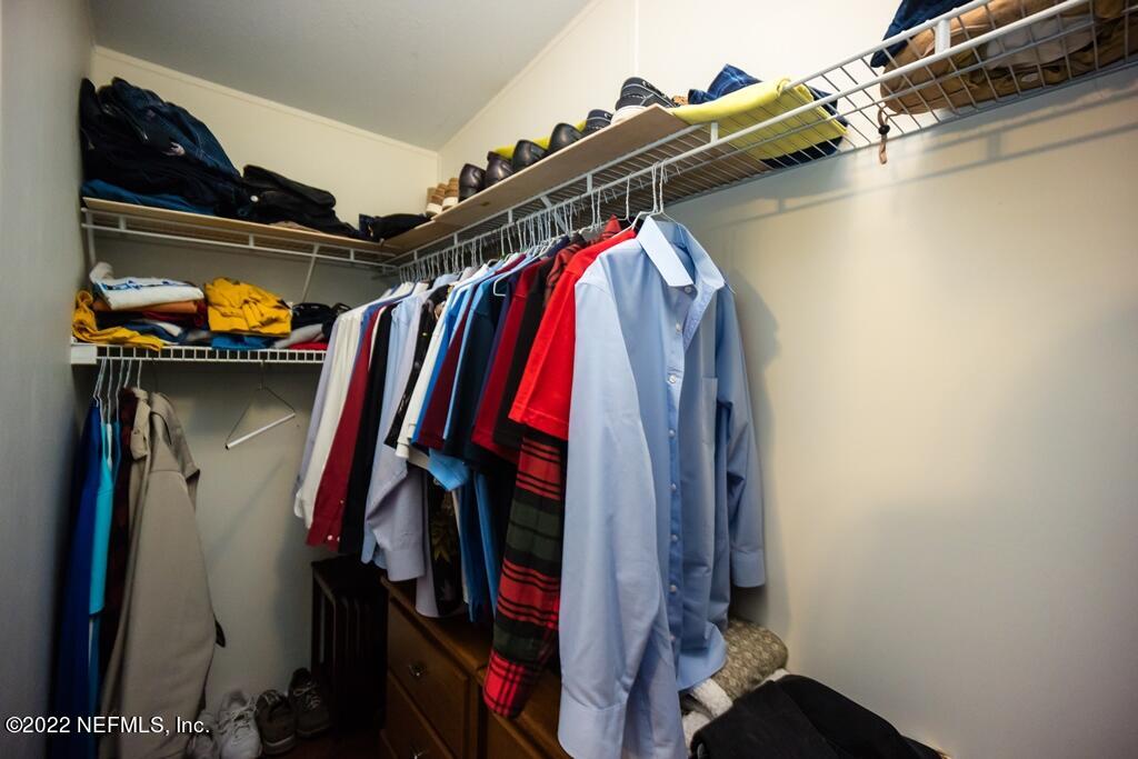 105 South Lake George Drive Georgetown, FL 32139 - Photo 33 of 71 a view of walk in closet with clothes and shoes