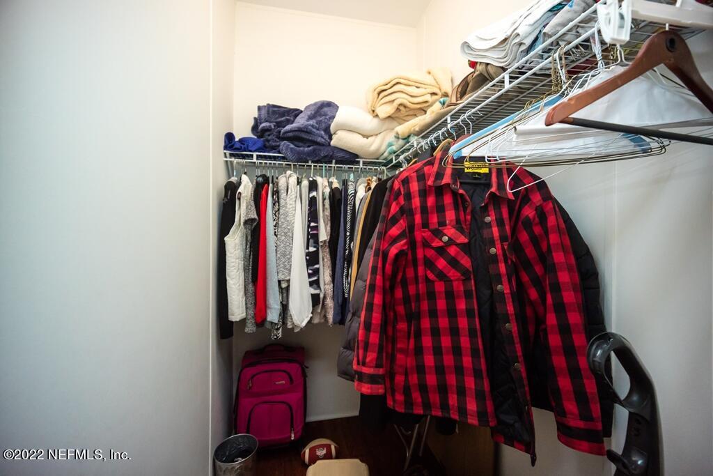 105 South Lake George Drive Georgetown, FL 32139 - Photo 37 of 71 a view of walk in closet with clothes and shoes