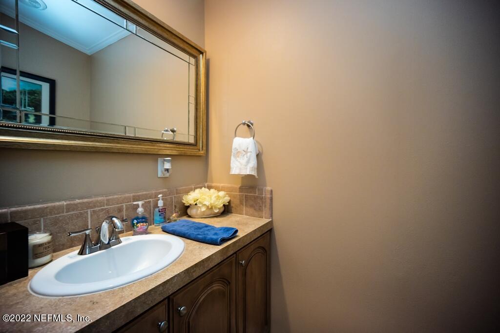 105 South Lake George Drive Georgetown, FL 32139 - Photo 43 of 71 a bathroom with a sink and a mirror