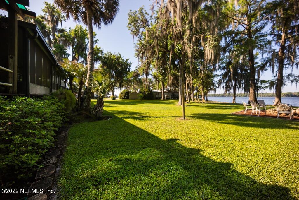 105 South Lake George Drive Georgetown, FL 32139 - Photo 57 of 71 a view of a swimming pool with an outdoor space and seating area